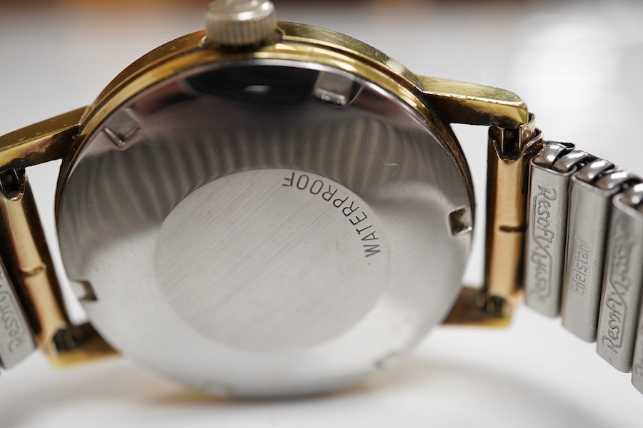 A gentleman's 1970's stainless steel and gold plated Omega automation wrist watch, case diameter 35mm, on an associated flexible strap, together with a Victorian silver open faced fob watch, a white metal half hunter poc